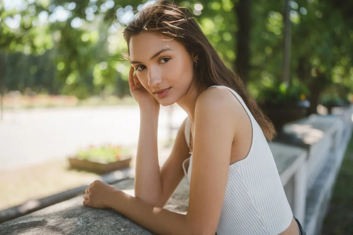 Dreamy soft portrait of a woman in a white top shot with a mist filter