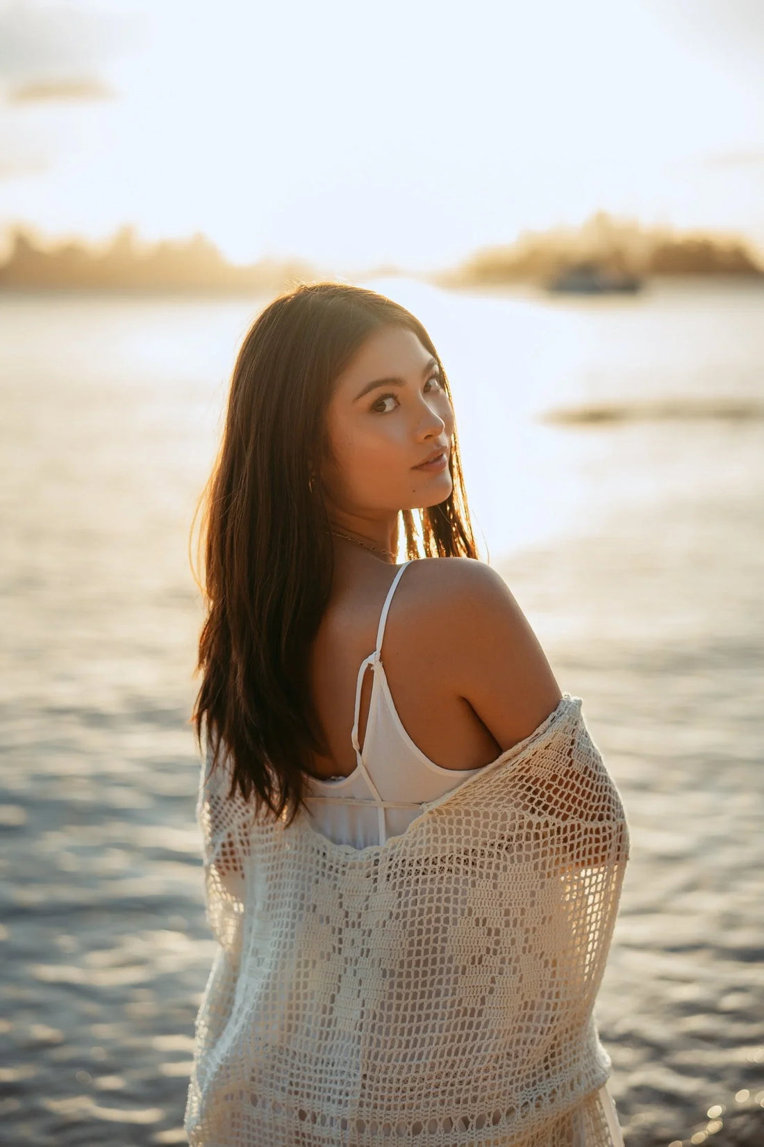 Backlit golden hour beach portrait on the Sony A7IV with the Zeiss 50mm f1.4, photo 1