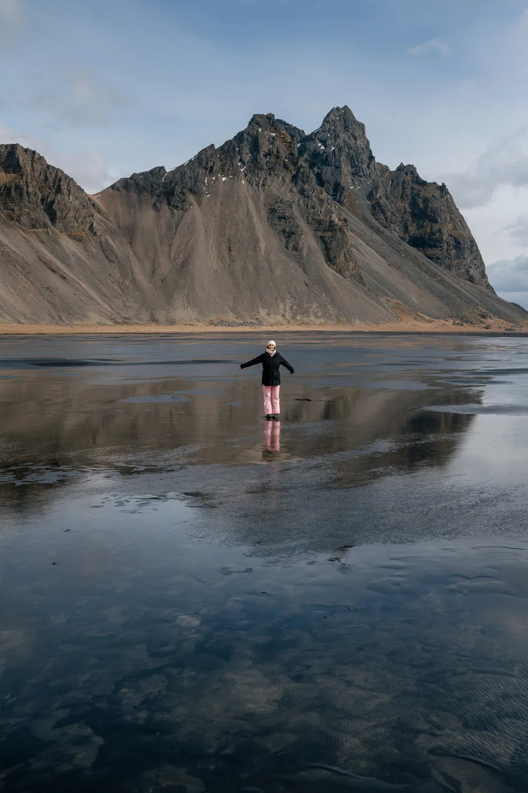 Vestrahorn mountain reflected in the black sand at Stokksnes, Iceland